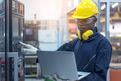 An Agilix Solutions employee conducting an Installed Based Evaluation for a client 