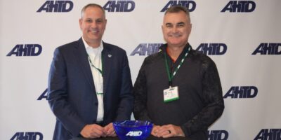Agilix Solutions CEO Mike Stanfill accepts award from AHTD