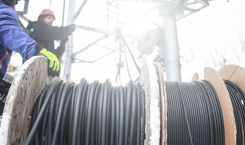 Cable installers preparing to install in cold weather