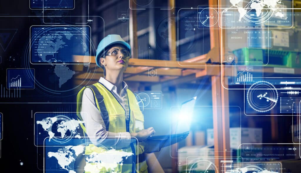 Woman unlocking manufacturing insights using Industry 4.0 technology.