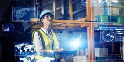 Woman unlocking manufacturing insights using Industry 4.0 technology.