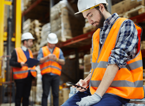 image of warehouse worker ordering from the Agilix website on his phone