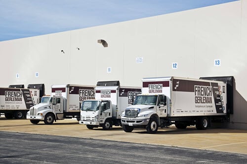 Agilix Solutions History - French Gerleman delivery trucks at loading docks
