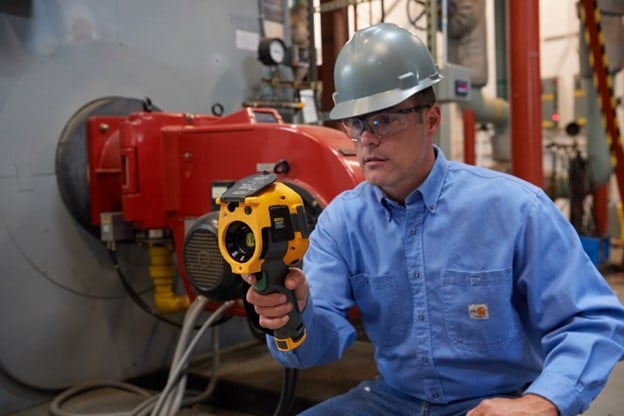 Man using Fluke tools for preventive maintenance