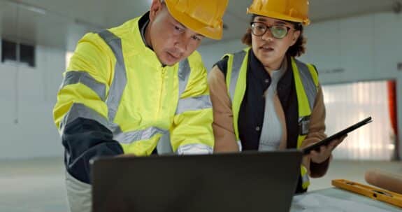 Industrial engineers working together with HOFFMAN DTM software.
