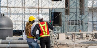 Construction workers leveraging Agilix Solutions as their commercial supply company on a building project.