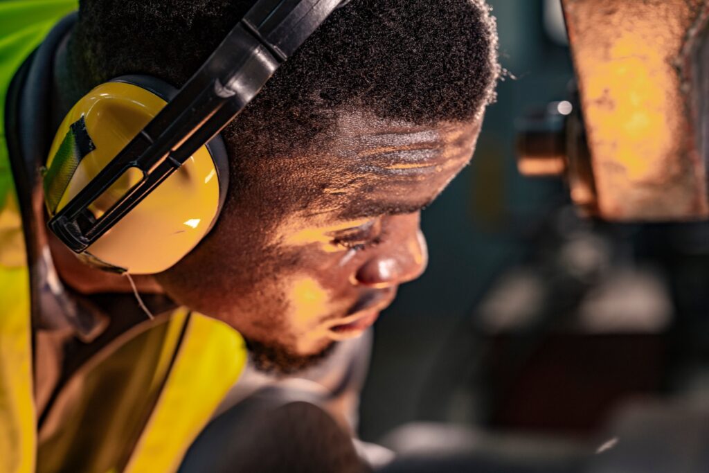 industrial worker wearing ear protection following a industrial hearing safety assessment
