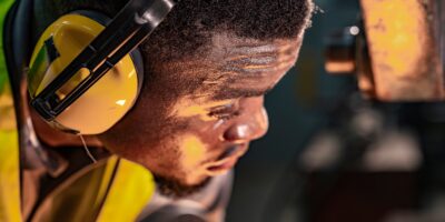 industrial worker wearing ear protection following a industrial hearing safety assessment